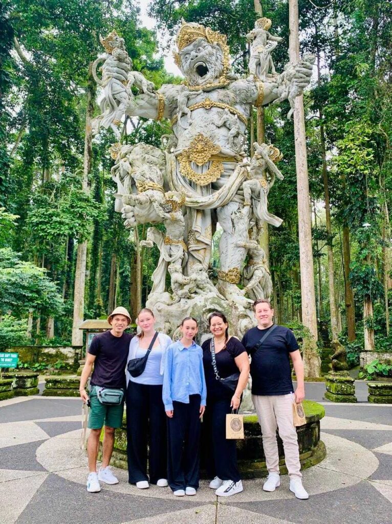 Happy tourists enjoying a Bali tour with private driver at temple